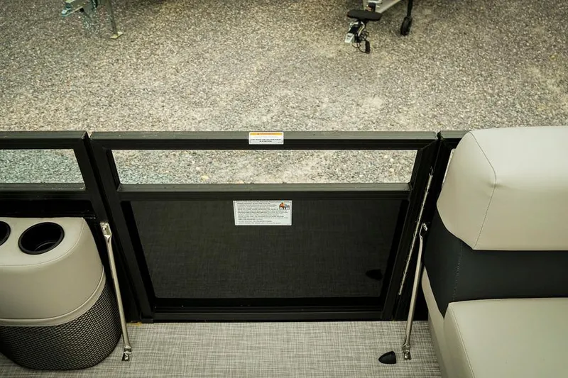 Slide: The Image of Interior view of a 2026 Dockside 20DQ boat, featuring seating and cup holders. - 22