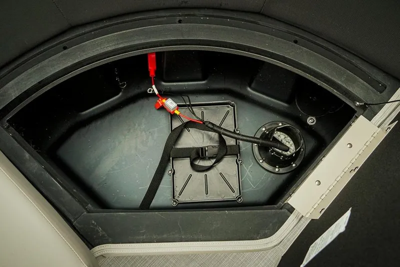 Slide: The Image of Storage compartment of 2026 Dockside 20DQ boat, featuring wiring and secure hatch. - 26