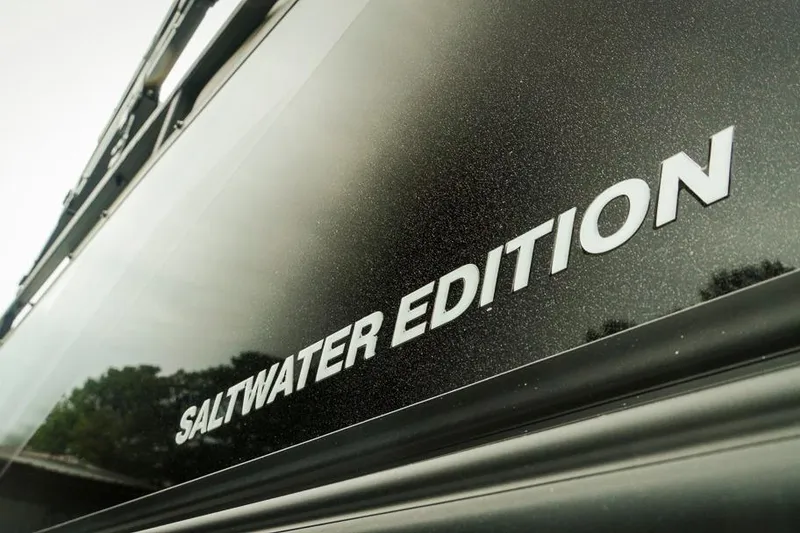 Slide: The Image of Close-up of Dockside 20DQ 2026 "Saltwater Edition" boat lettering. - 3