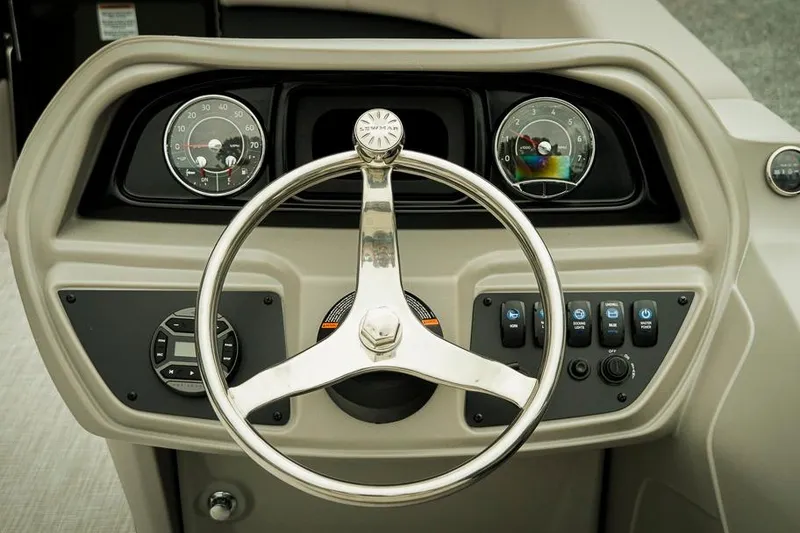 Slide: The Image of Steering console of 2026 Dockside 20DQ boat with gauges and controls. - 8