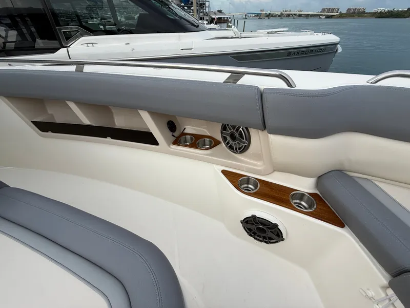 Slide: The Image of The 2027 Boston Whaler 350 Realm features luxurious seating and high-quality speakers. - 11