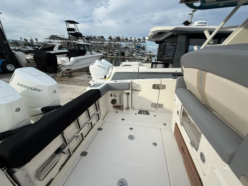 Slide: The Image of The image shows the spacious cockpit of a Boston Whaler 350 Realm with comfortable seating and modern features. - 34