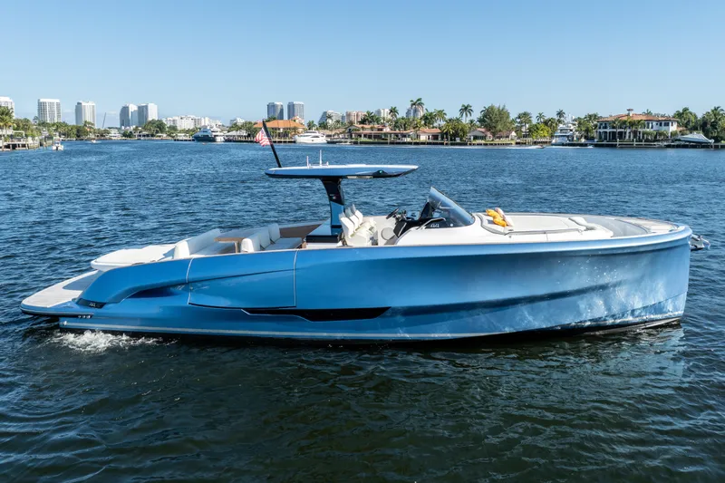 The Image of 2025 Solaris Power 44 Open yacht cruising on a sunny day in a scenic waterfront setting. - 1