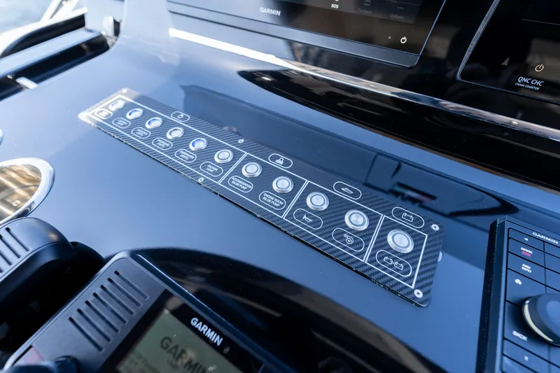 Slide: The Image of Control panel of 2025 Solaris Power 44 Open yacht with modern navigation systems. - 15
