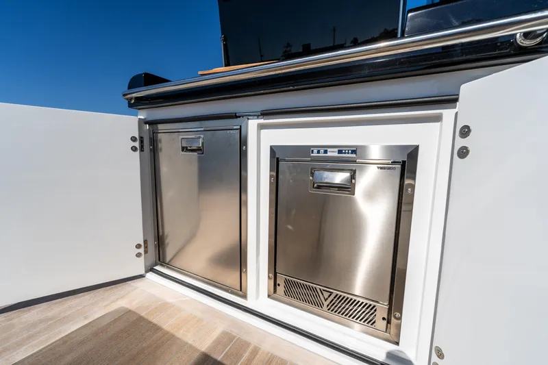Slide: The Image of Stainless steel appliances on Solaris Power 44 Open yacht, 2025 model, under clear blue sky. - 19
