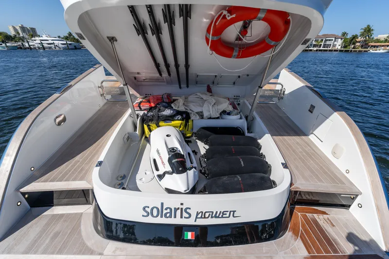 Slide: The Image of 2025 Solaris Power 44 Open yacht with open storage compartment, docked by the water. - 29