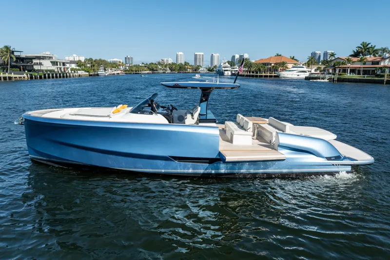 Slide: The Image of 2025 Solaris Power 44 Open yacht cruising on a scenic waterway, showcasing sleek design and luxury. - 3