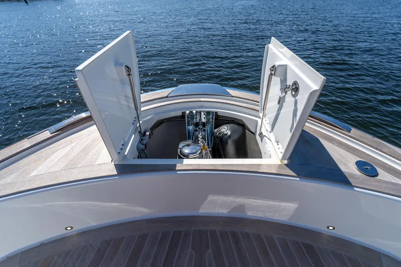 Slide: The Image of 2025 Solaris Power 44 Open yacht with open storage compartment on deck, overlooking water. - 36