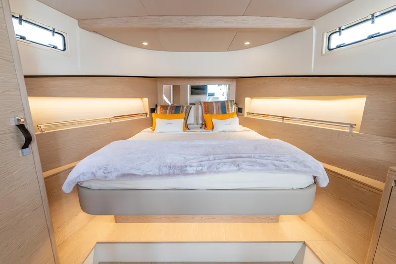 Slide: The Image of Luxurious cabin interior of 2025 Solaris Power 44 Open yacht, featuring a cozy bed and modern design. - 38