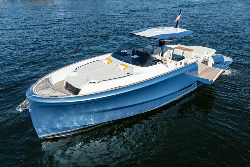 Slide: The Image of 2025 Solaris Power 44 Open yacht cruising on water, featuring sleek blue design. - 4