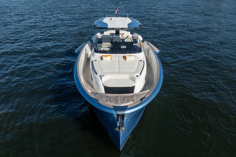 Slide: The Image of 2025 Solaris Power 44 Open yacht on calm water, showcasing sleek design. - 48