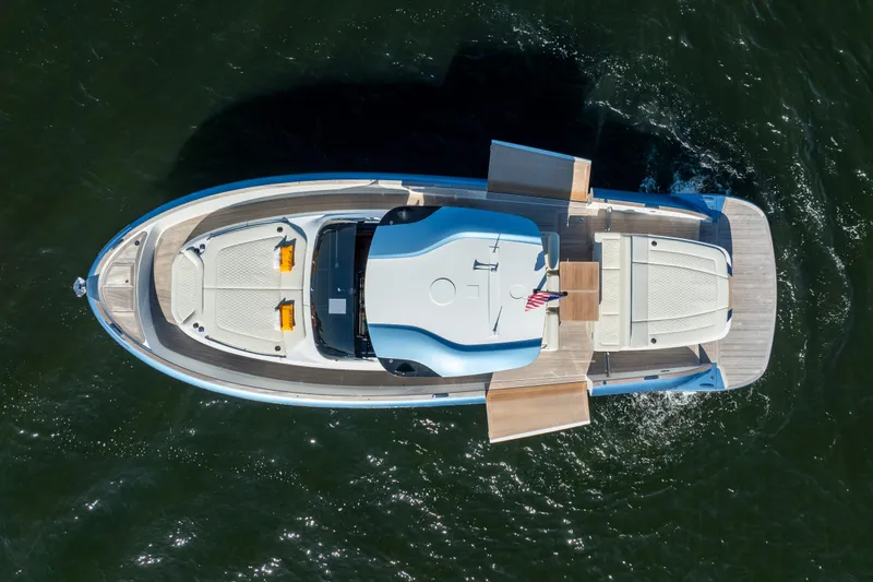 Slide: The Image of 2025 Solaris Power 44 Open yacht, aerial view, cruising on water with extended decks. - 49