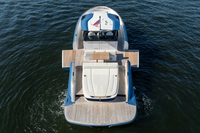 Slide: The Image of 2025 Solaris Power 44 Open yacht on water, showcasing sleek design and spacious deck. - 8