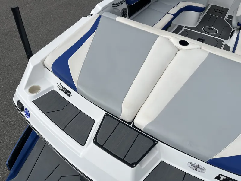 Slide: The Image of Rear view of a 2019 Axis T22 boat with gray and blue upholstery. - 12