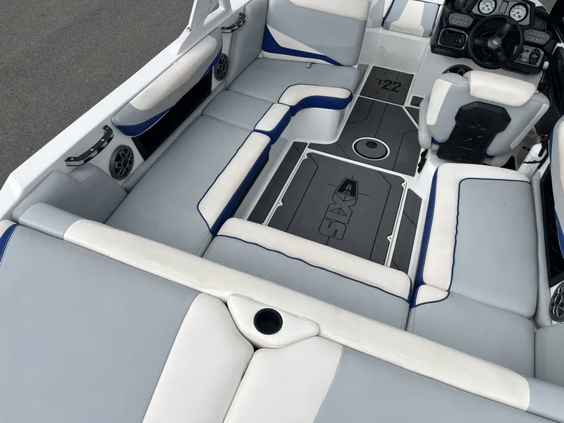 Slide: The Image of Interior of a 2019 Axis T22 boat with gray and blue upholstery. - 13