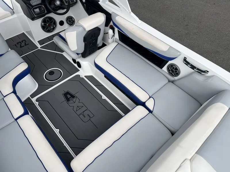 Slide: The Image of Interior of a 2019 Axis T22 boat with gray and blue seating. - 14