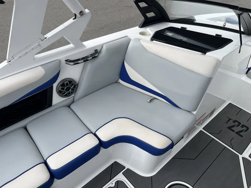 Slide: The Image of Interior of a 2019 Axis T22 boat with gray and blue seating. - 17