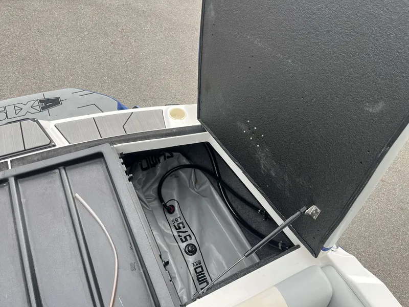 Slide: The Image of Open storage compartment of a 2019 Axis T22 boat. - 21