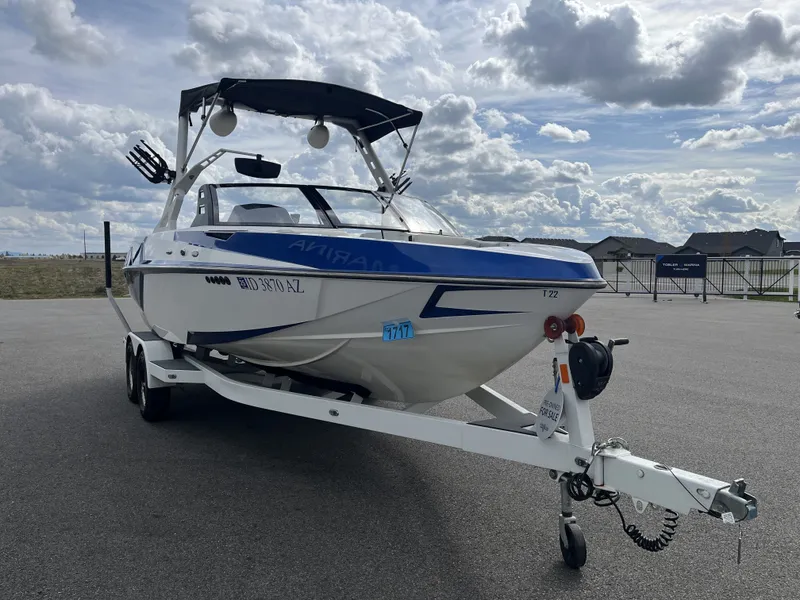 Slide: The Image of 2019 Axis T22 boat on trailer under cloudy sky. - 4