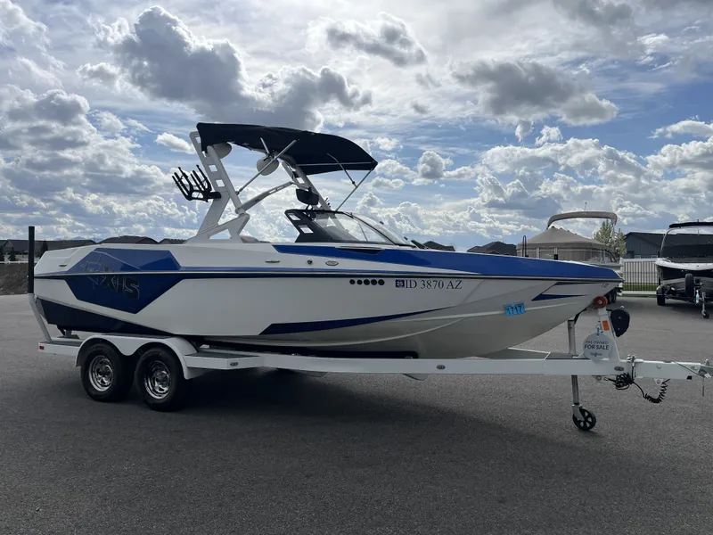 Slide: The Image of 2019 Axis T22 boat on trailer under cloudy sky. - 5