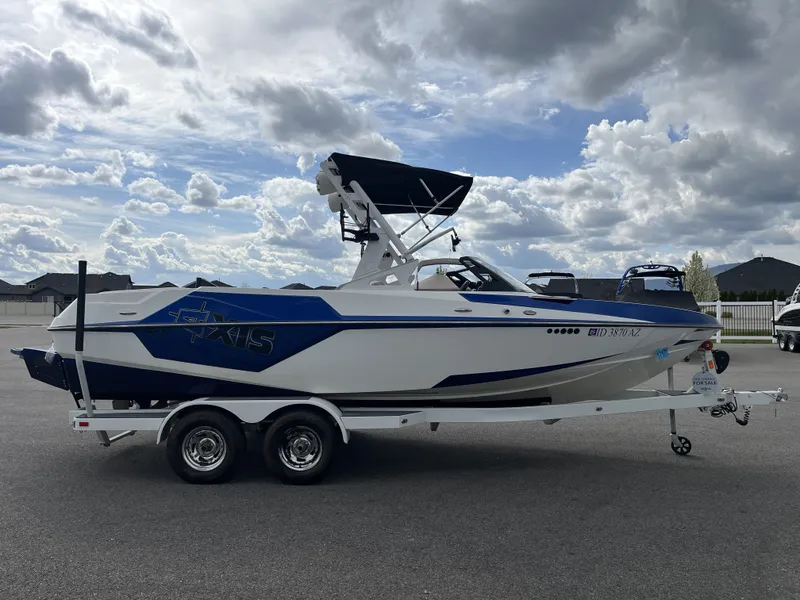 Slide: The Image of 2019 Axis T22 boat on trailer under cloudy sky. - 6