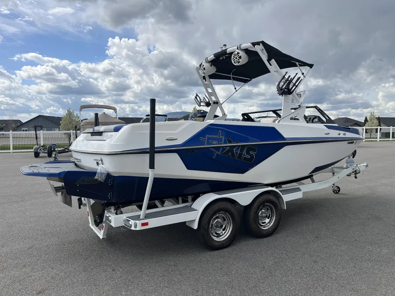 Slide: The Image of 2019 Axis T22 boat on trailer under cloudy sky. - 7