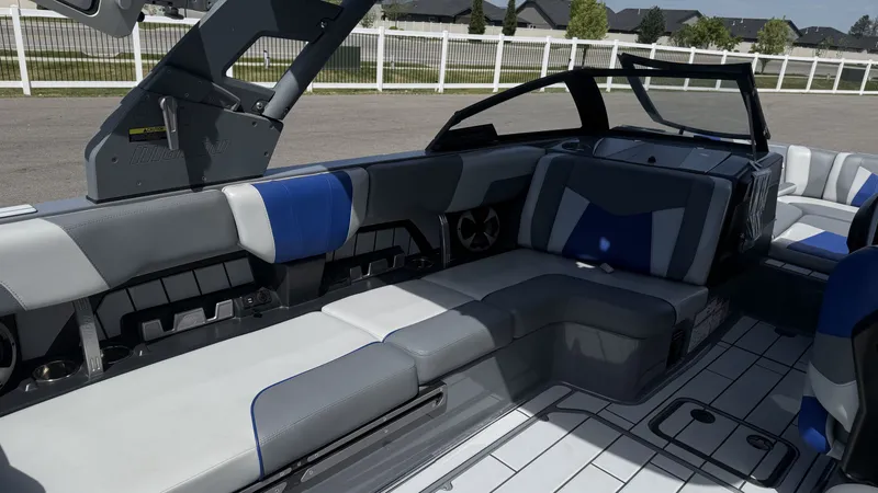Slide: The Image of Interior of 2020 Malibu Wakesetter 23 MXZ with gray and blue seating. - 10