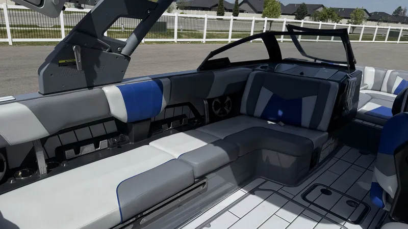 Slide: The Image of Interior of 2020 Malibu Wakesetter 23 MXZ with gray and blue seating. - 11