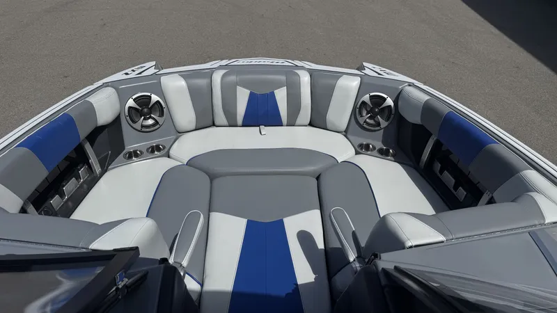 Slide: The Image of Interior of 2020 Malibu Wakesetter 23 MXZ with gray and blue seating. - 13