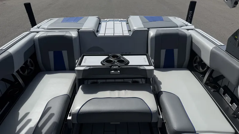 Slide: The Image of Interior of 2020 Malibu Wakesetter 23 MXZ with gray and blue seating. - 16
