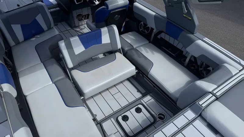 Slide: The Image of Interior of 2020 Malibu Wakesetter 23 MXZ with gray and blue seating. - 17