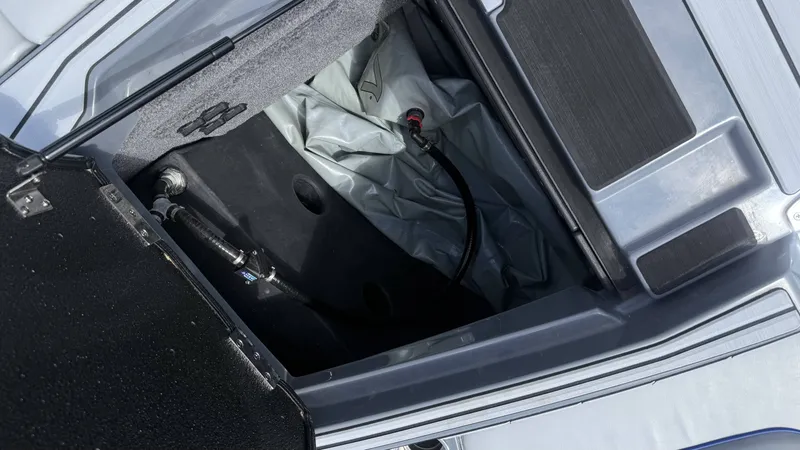 Slide: The Image of Interior view of 2020 Malibu Wakesetter 23 MXZ storage compartment. - 18