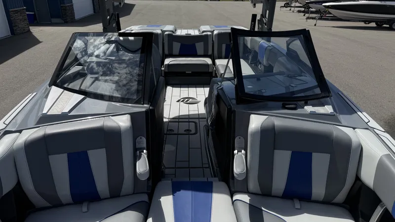 Slide: The Image of Interior of 2020 Malibu Wakesetter 23 MXZ with blue and gray seating. - 19