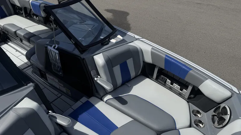 Slide: The Image of Interior of 2020 Malibu Wakesetter 23 MXZ with gray and blue seating. - 20