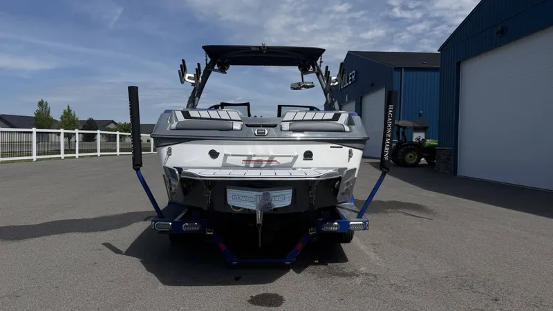 Slide: The Image of Rear view of a 2020 Malibu Wakesetter 23 MXZ boat on a trailer. - 7