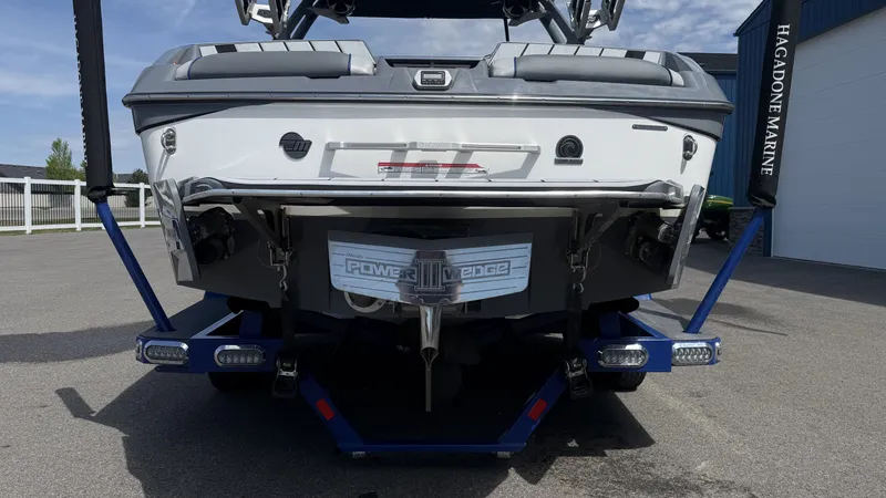 Slide: The Image of Rear view of a 2020 Malibu Wakesetter 23 MXZ on a trailer. - 8