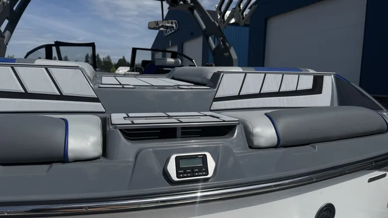 Slide: The Image of 2020 Malibu Wakesetter 23 MXZ boat rear with gray upholstery. - 9