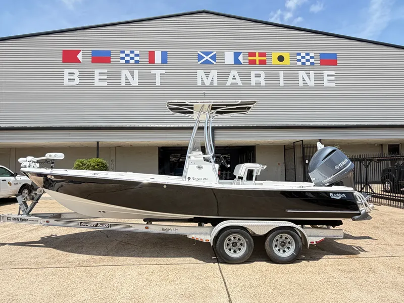 The Image of Black BlackJack 224 boat from 2011 in front of Bent Marine building. - 1