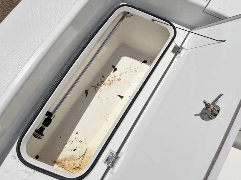 Slide: The Image of Open storage compartment of a 2011 BlackJack 224 boat. - 13