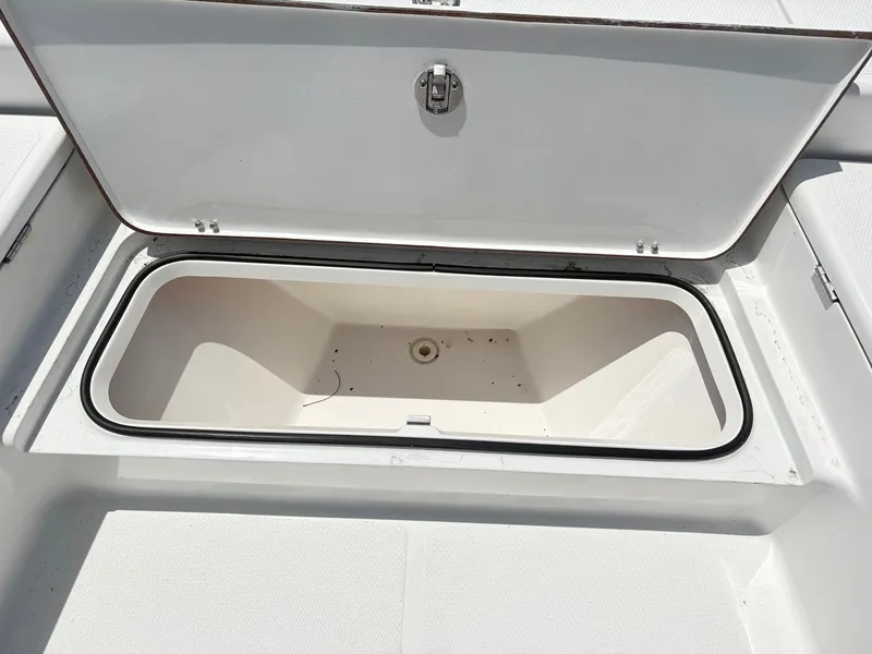 Slide: The Image of Open storage compartment on a 2011 BlackJack 224 boat. - 14