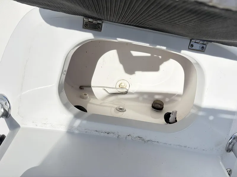 Slide: The Image of Open storage compartment of a 2011 BlackJack 224 boat. - 16