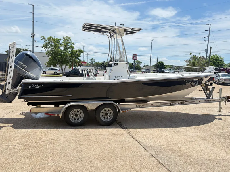 Slide: The Image of Black BlackJack 224 boat from 2011 on trailer with Yamaha engine. - 4