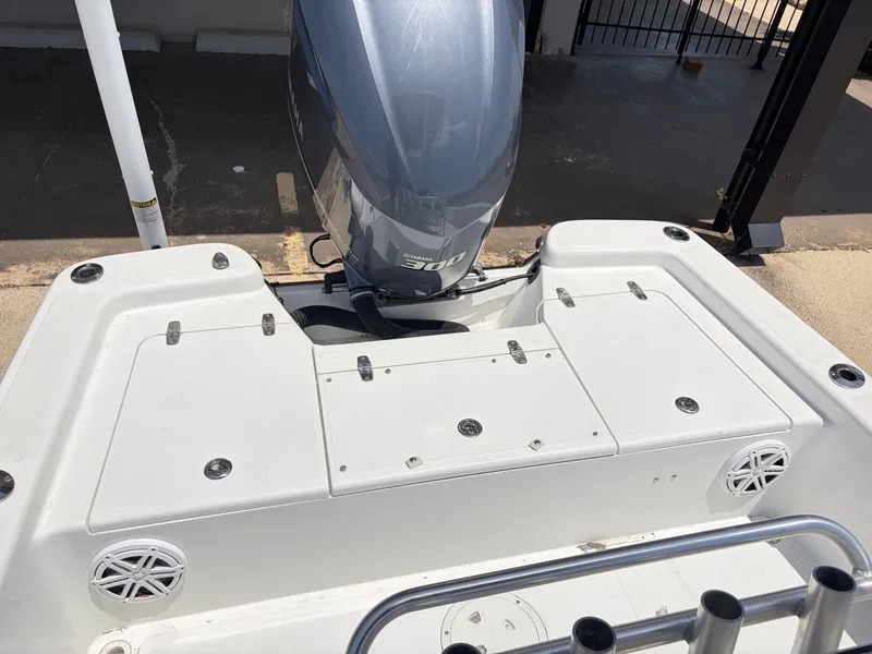Slide: The Image of Rear view of a BlackJack 224 boat with Yamaha engine. - 7
