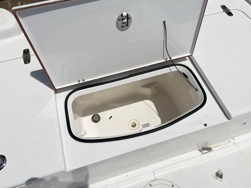 Slide: The Image of Open storage compartment on a 2011 BlackJack 224 boat. - 8