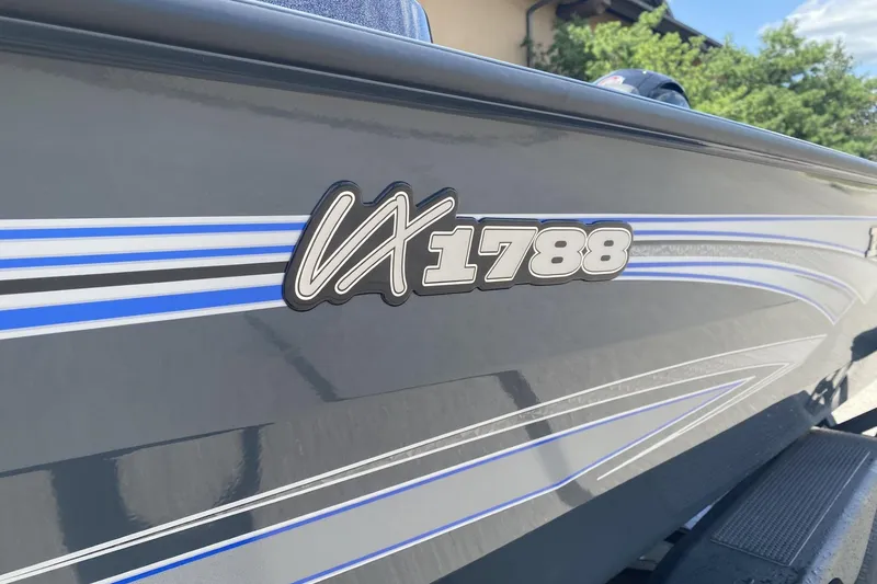 Slide: The Image of 2026 Ranger VX1788 WT boat with sleek blue and gray design. - 2