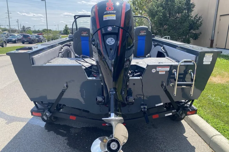 Slide: The Image of 2026 Ranger VX1788 WT boat with powerful outboard motor, parked outdoors. - 5