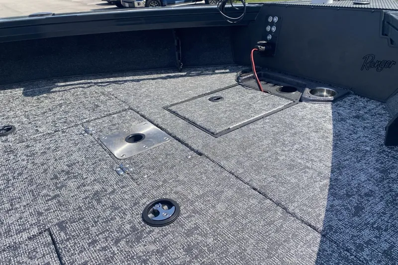 Slide: The Image of 2026 Ranger VX1788 WT boat deck with storage compartments and control panel. - 7