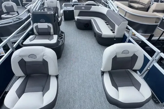 Slide: The Image of 2026 Sun Tracker Bass Buggy 18 DLX pontoon boat interior with gray seating. - 11