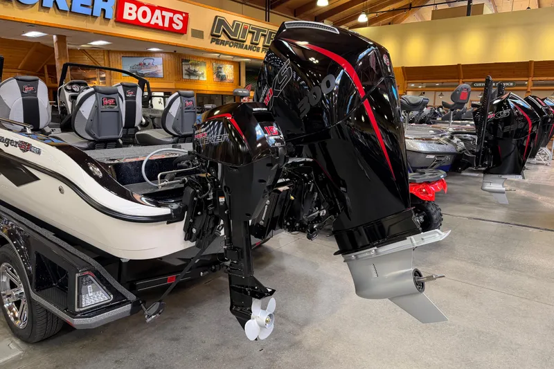 Slide: The Image of 2026 Ranger 621FS Cup-Equipped boat with powerful outboard motor in showroom. - 10