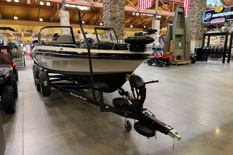 Slide: The Image of 2026 Ranger 621FS Cup-Equipped boat displayed indoors on a trailer. - 2